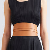 Side view of long black coat with clean lines.